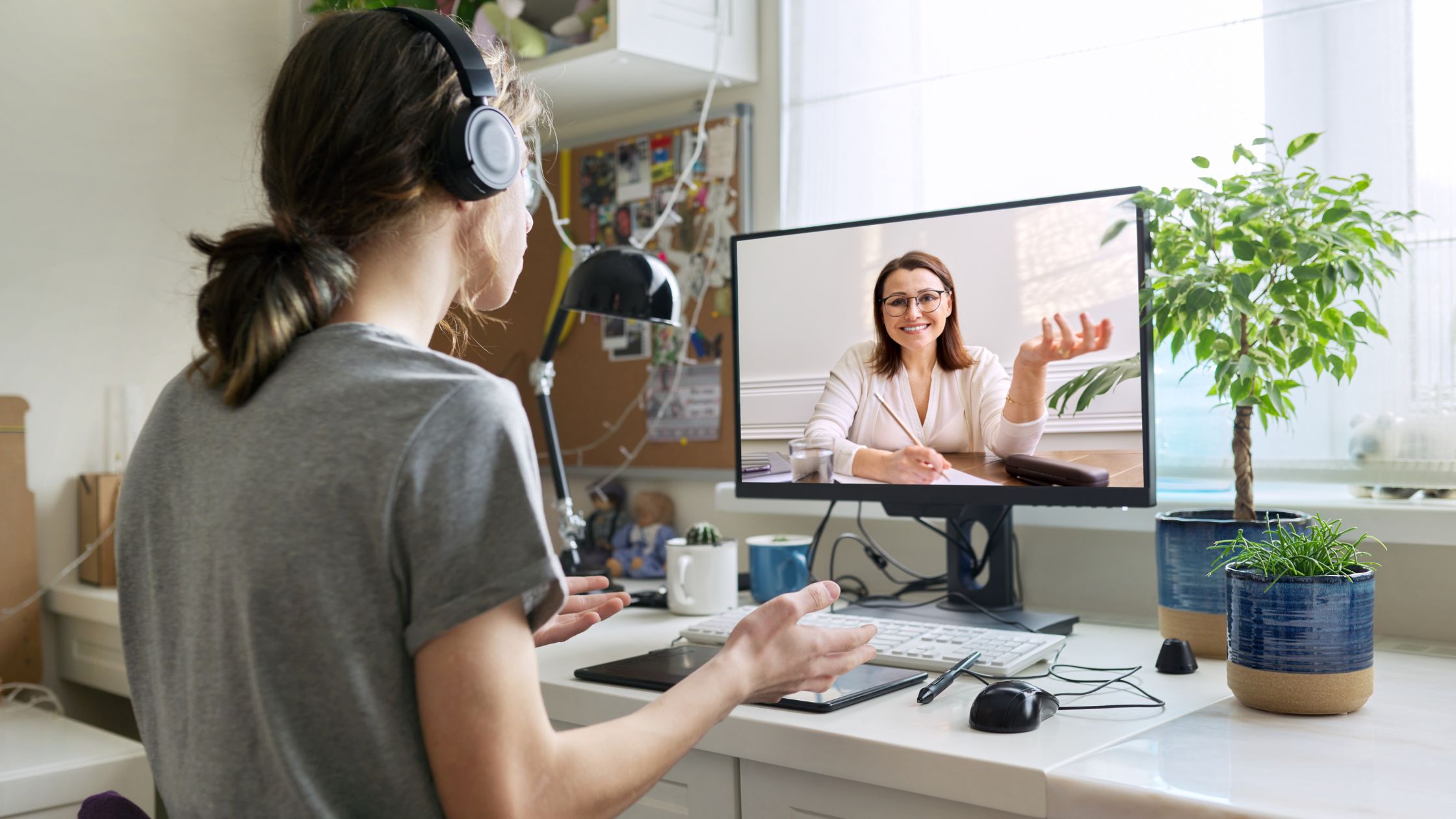 Young man video conferencing with his Launch career coach